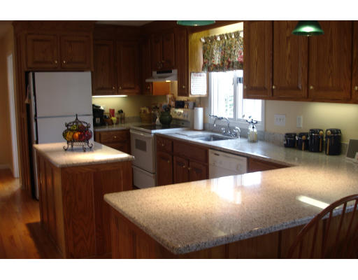 4 Andrea Terrace Shirley, MA 01464 - Photo 7 of 19 a kitchen with stainless steel appliances a sink dishwasher stove top oven and cabinets