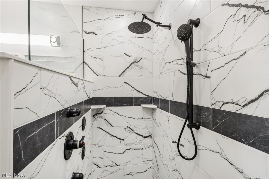 6535 North Ridge Road West Geneva, OH 44041 - Photo 28 of 48 Bathroom view of a marble finish shower