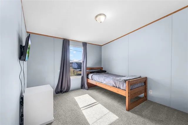 a room with a bed and a window