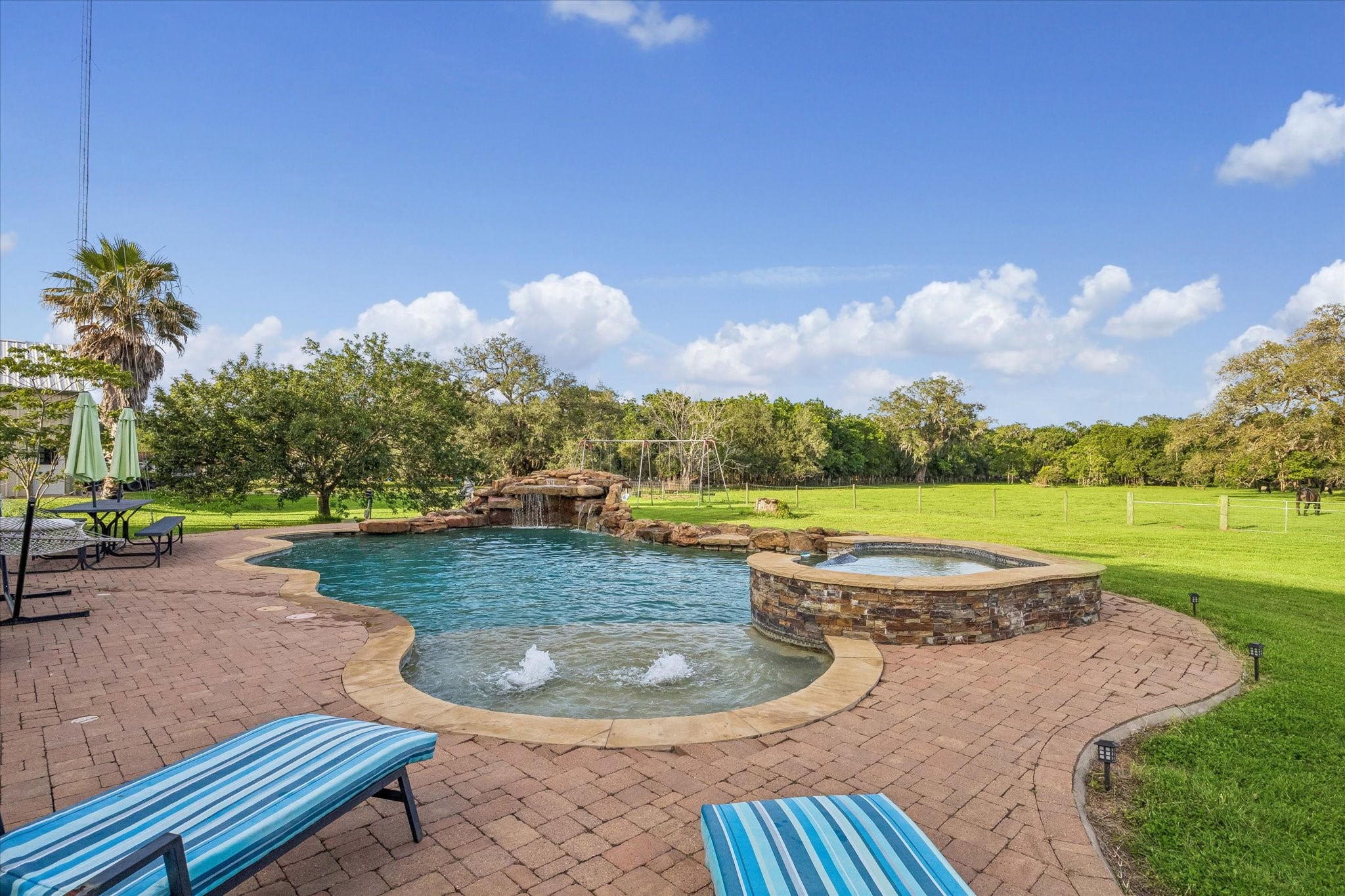 3515 County Road 36 Angleton, TX 77515 - Photo 41 of 50 a view of a swimming pool with a yard and plants