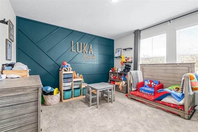 a room with furniture and gym equipment