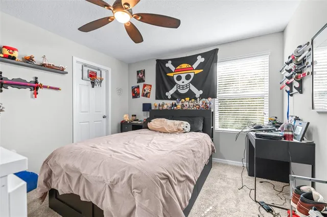 a bedroom with a bed and a table in it