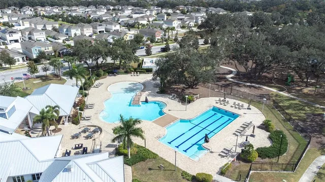 an aerial view of residential houses with outdoor space