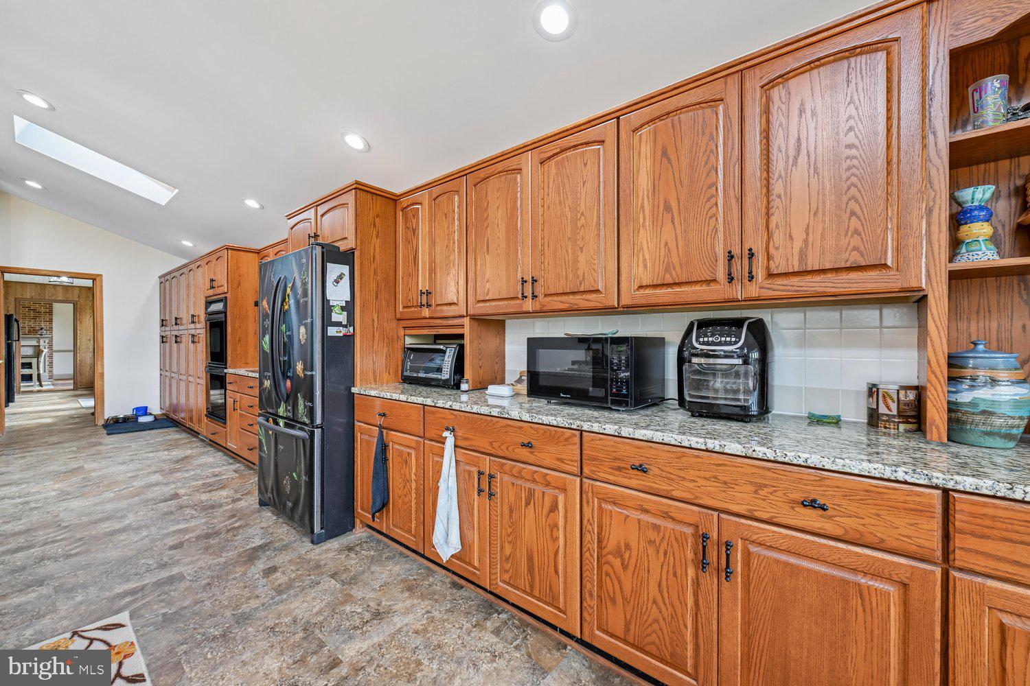 17401 Milltown Landing Road Brandywine, MD 20613 - Photo 34 of 96 Spacious kitchen with rich wooden cabinetry.