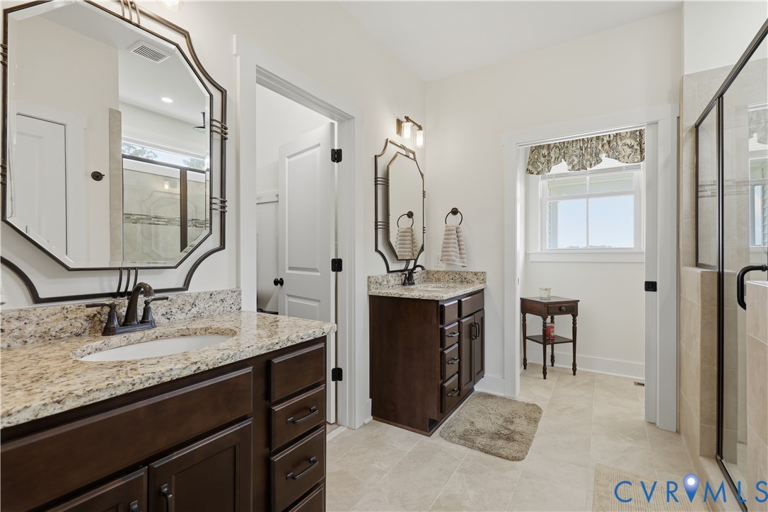 25181 West Soap Stone Road Jetersville, VA 23083 - Photo 22 of 54 Double vanity bathroom featuring granite counterto
