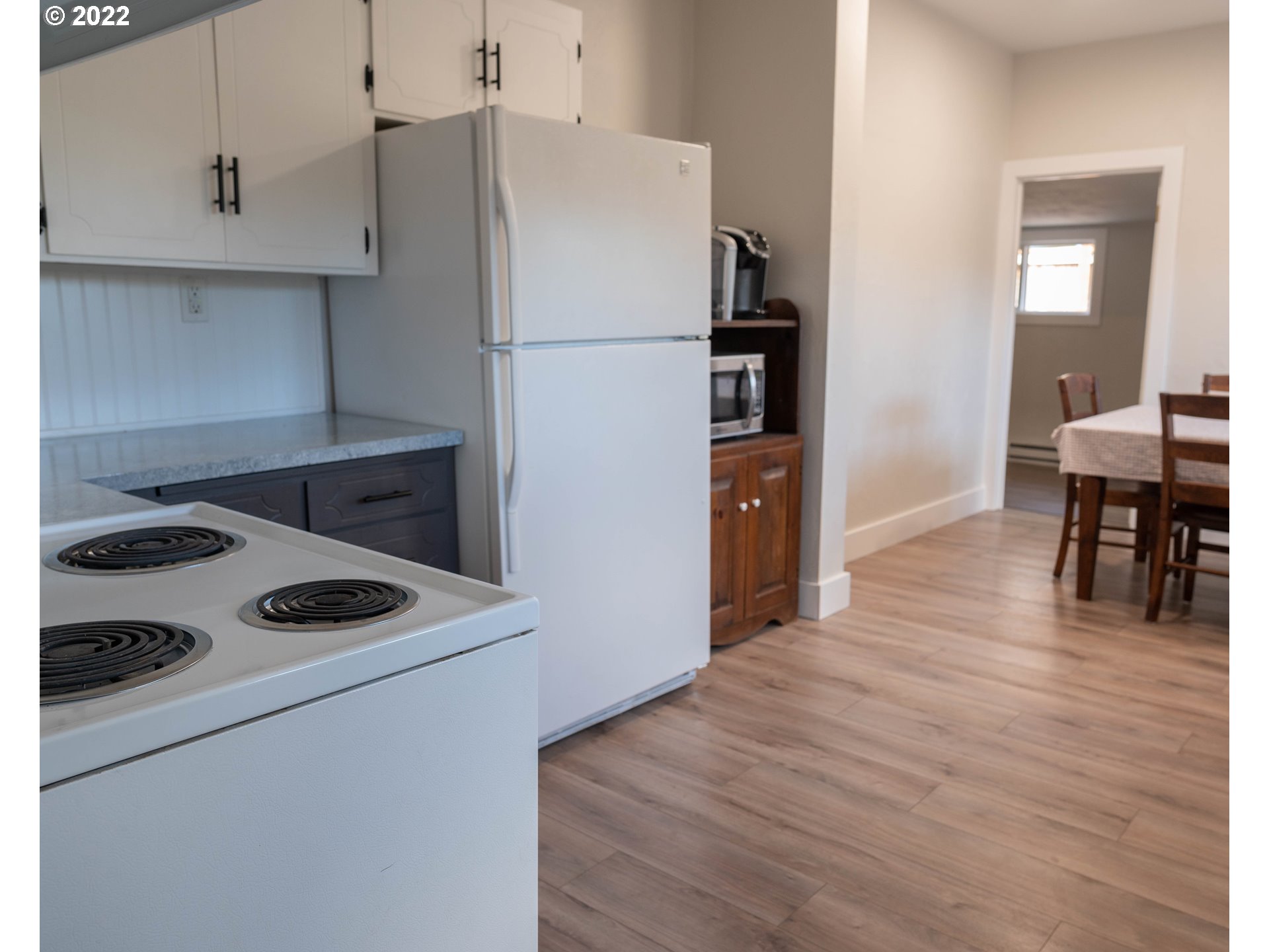 36227 Enterprise Road Creswell, OR 97426 - Photo 11 of 32 a white refrigerator freezer sitting inside of a kitchen