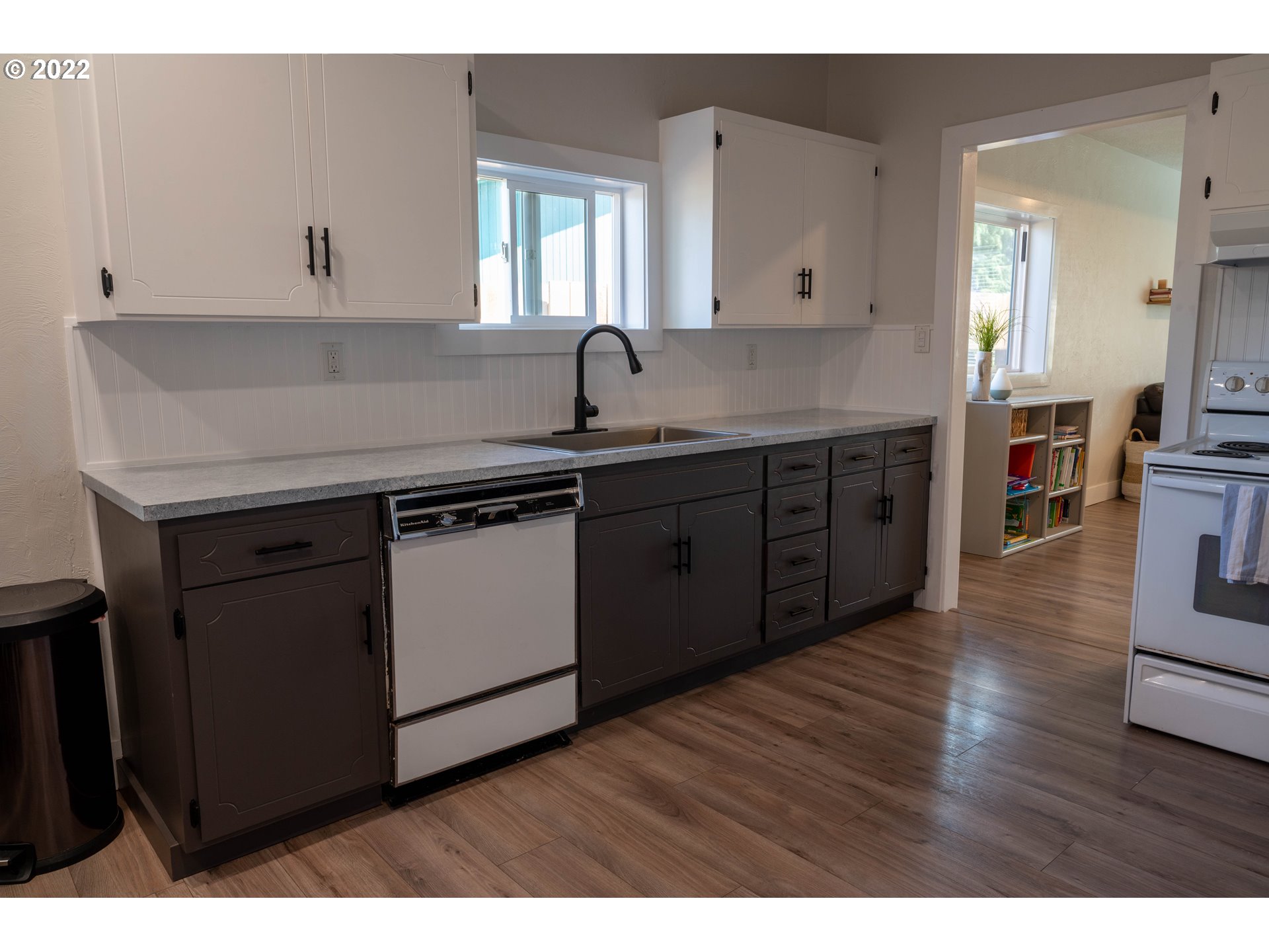 36227 Enterprise Road Creswell, OR 97426 - Photo 12 of 32 a kitchen with a sink and wooden cabinets