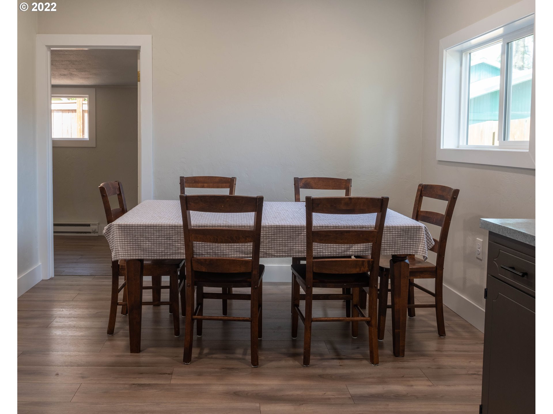 36227 Enterprise Road Creswell, OR 97426 - Photo 13 of 32 a view of a dining room with furniture and wooden floor