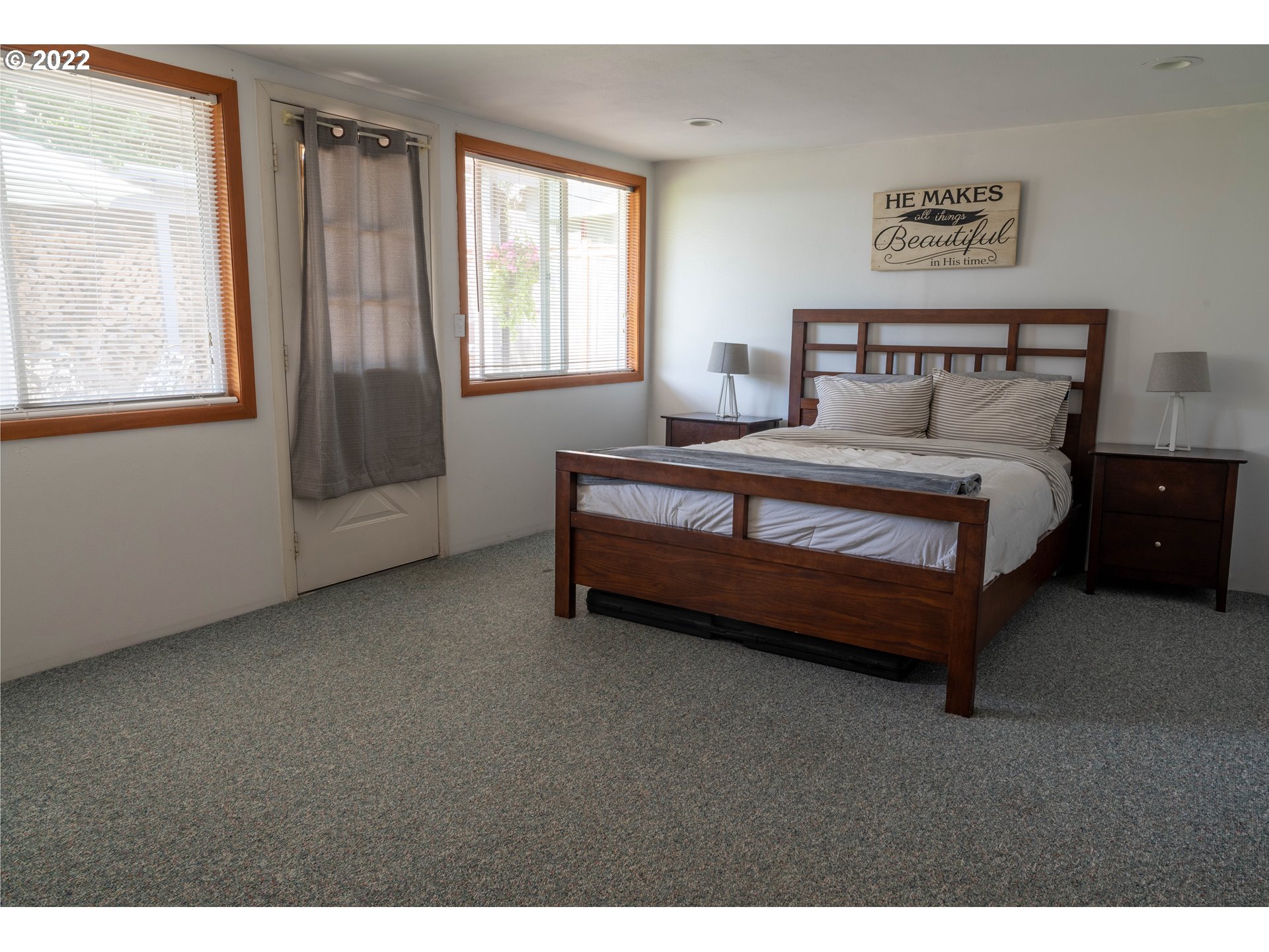 36227 Enterprise Road Creswell, OR 97426 - Photo 14 of 32 a spacious bedroom with a bed and window