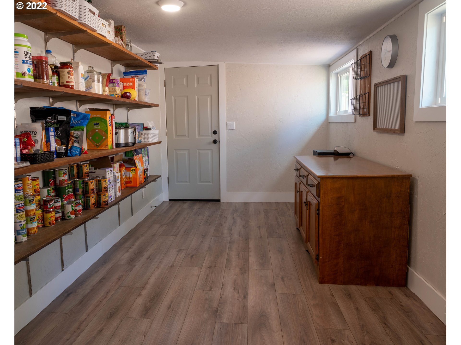 36227 Enterprise Road Creswell, OR 97426 - Photo 25 of 32 a room with lots of wooden furniture and a book shelf
