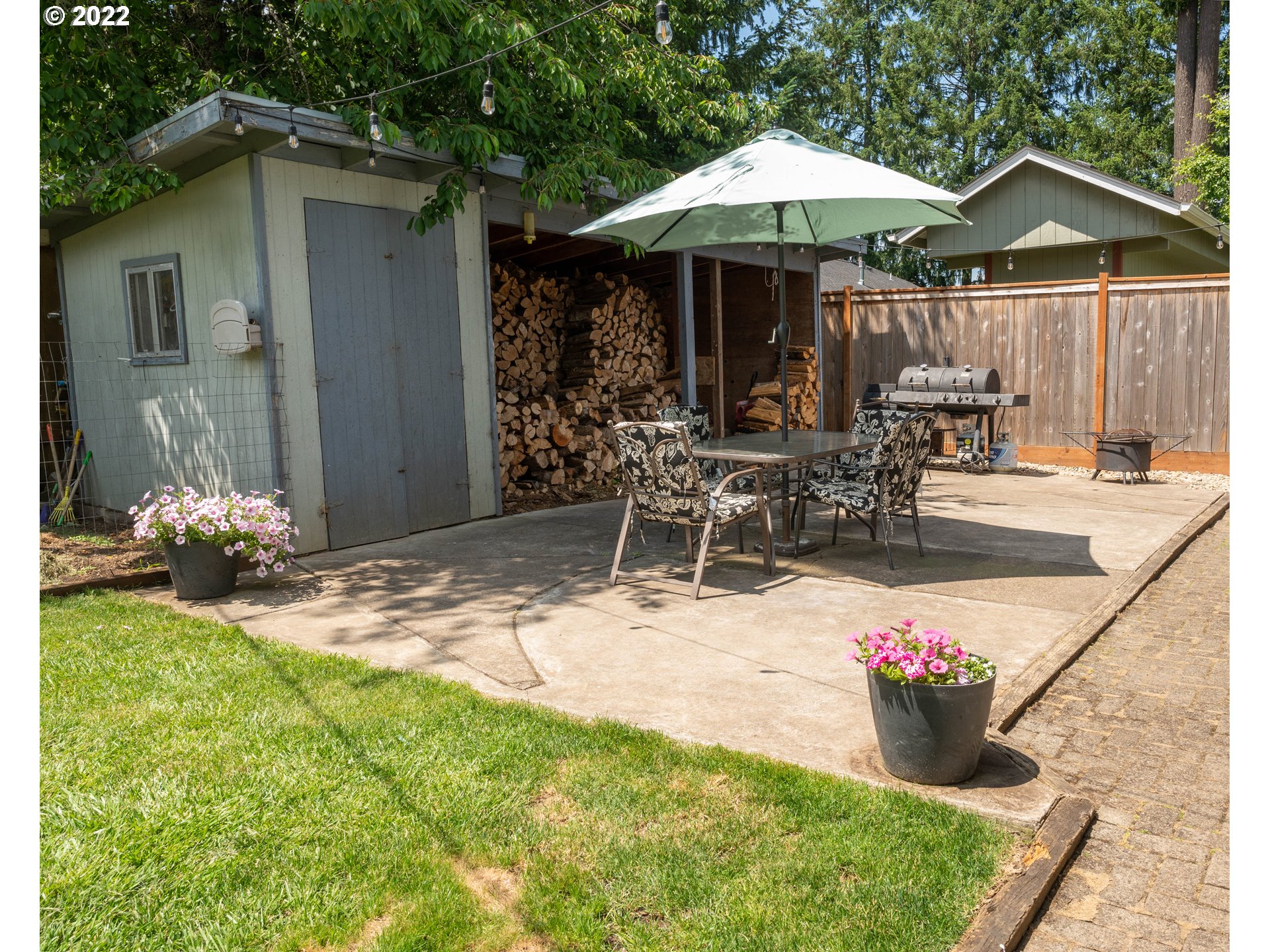 36227 Enterprise Road Creswell, OR 97426 - Photo 28 of 32 a view of a patio with table and chairs under an umbrella
