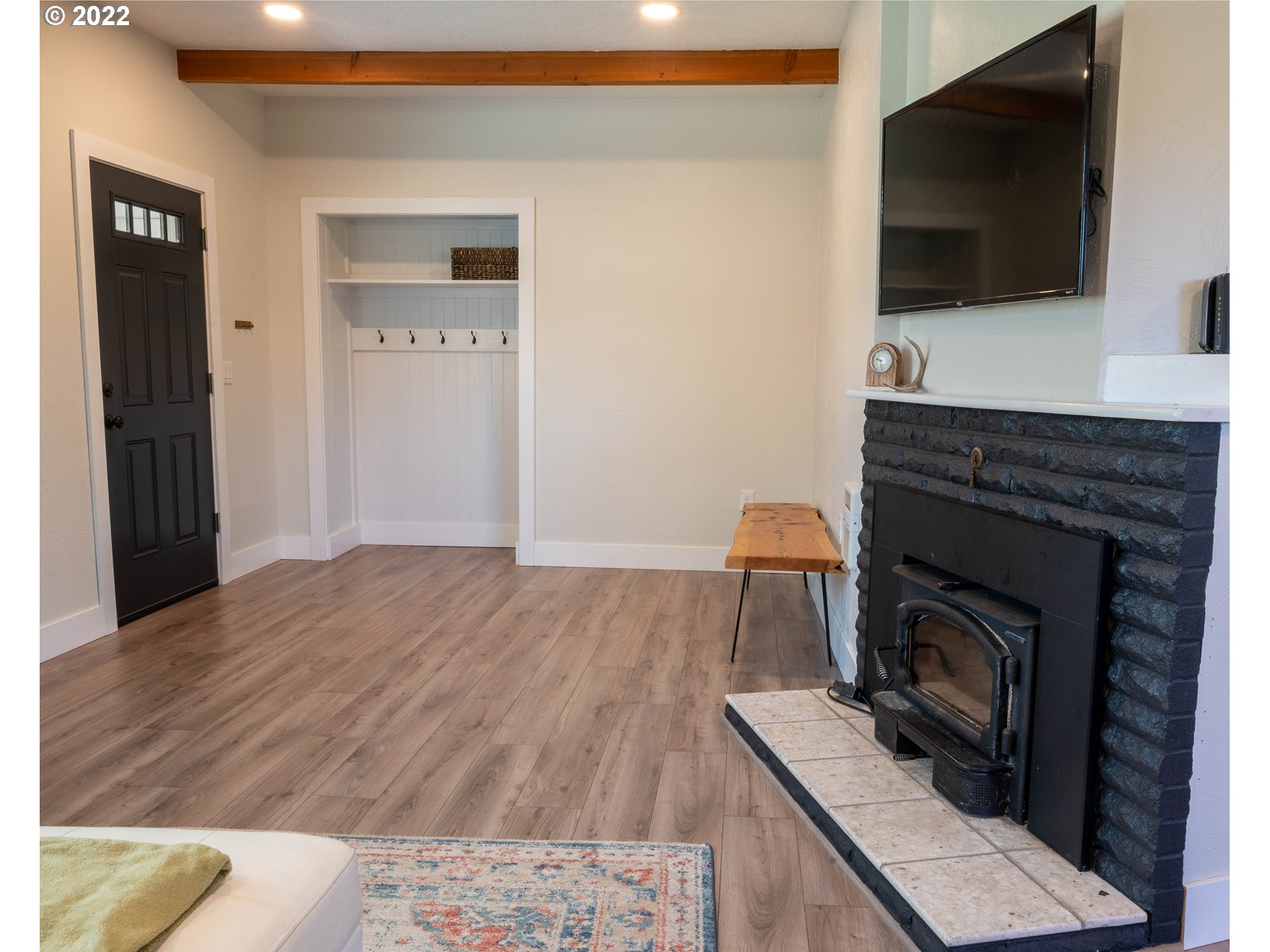 36227 Enterprise Road Creswell, OR 97426 - Photo 5 of 32 a living room with furniture a flat screen tv and a fireplace