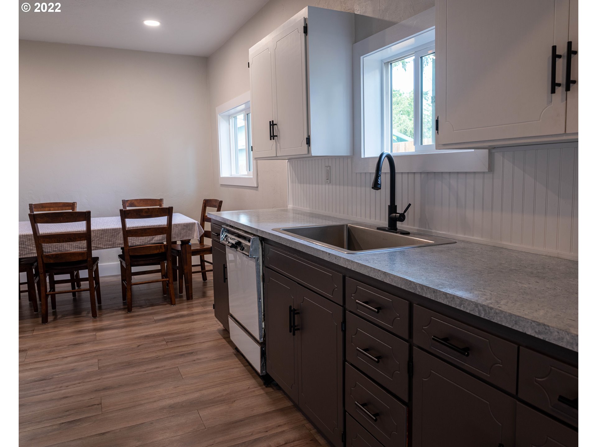 36227 Enterprise Road Creswell, OR 97426 - Photo 9 of 32 a kitchen with stainless steel appliances granite countertop a sink counter space and wooden floor