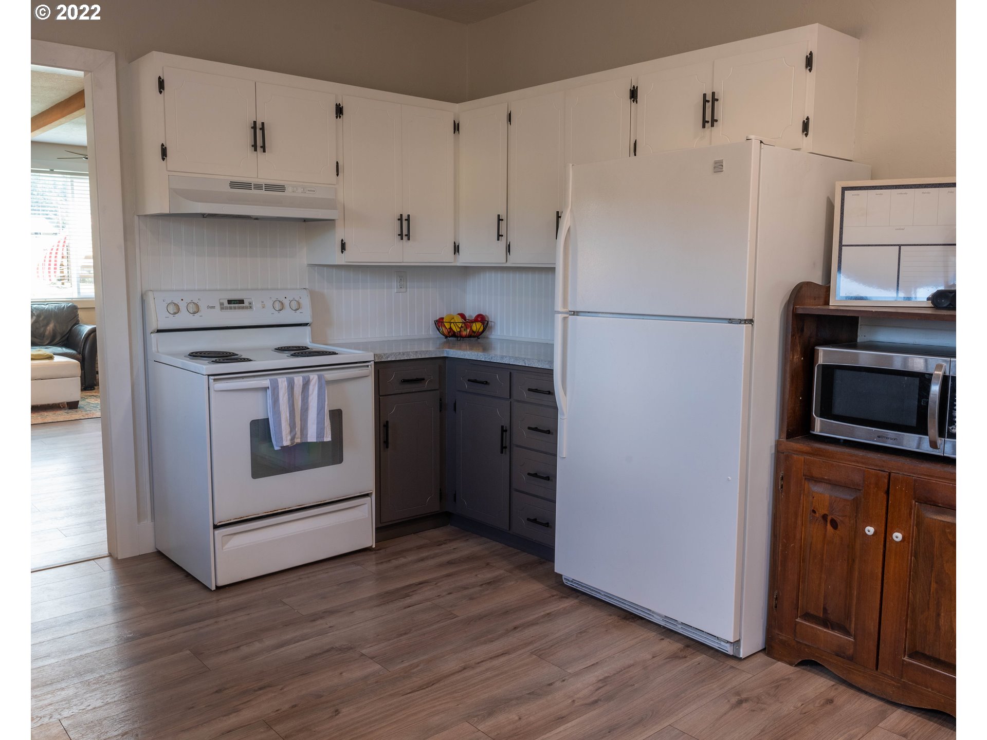 36227 Enterprise Road Creswell, OR 97426 - Photo 10 of 32 a kitchen with cabinets appliances and wooden floor