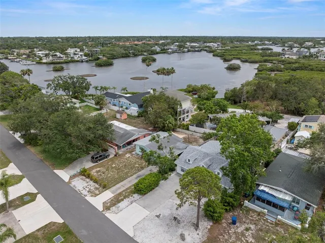an aerial view of a house with a yard and garden