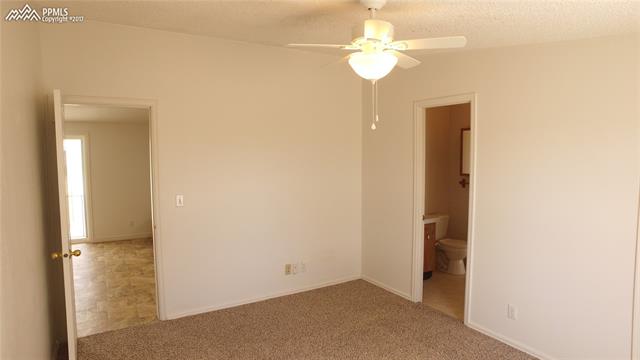 5710 Prospero Road Peyton, CO 80831 - Photo 19 of 34 Bedroom 2 Attached to Jack and Jill Bathroom