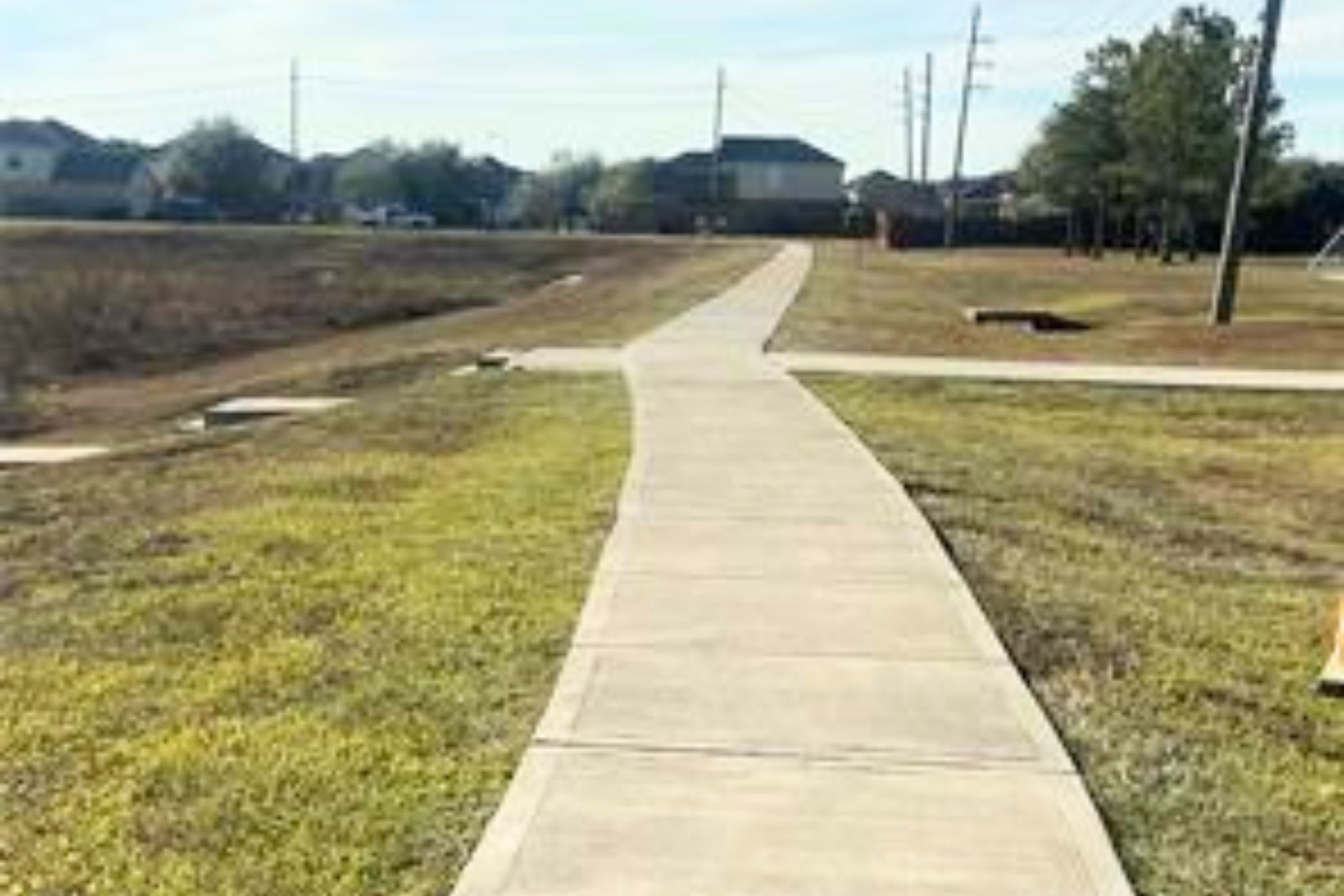 8310 Rose Petals Lane Rosharon, TX 77583 - Photo 34 of 37 Scenic walking and jogging trail in Southern Colony, winding through open green space and connecting residents to the neighborhood parks and recreational areas. This paved trail offers a perfect place for daily walks, jogging, or enjoying the outdoors in a peaceful community setting.