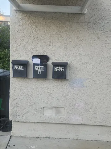 a view of a bench in a parking area
