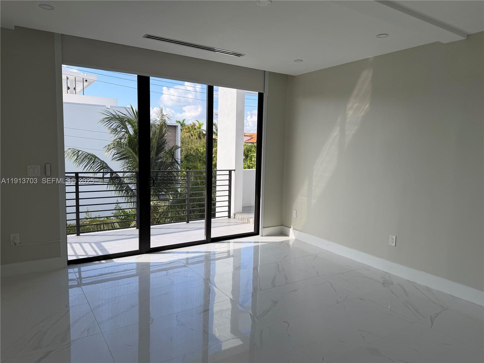 570 Fernwood Road Key Biscayne, FL 33149 - Photo 12 of 18 a view of a room with large windows