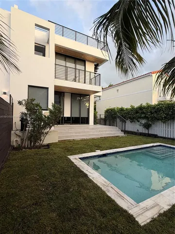 a view of a house with a swimming pool