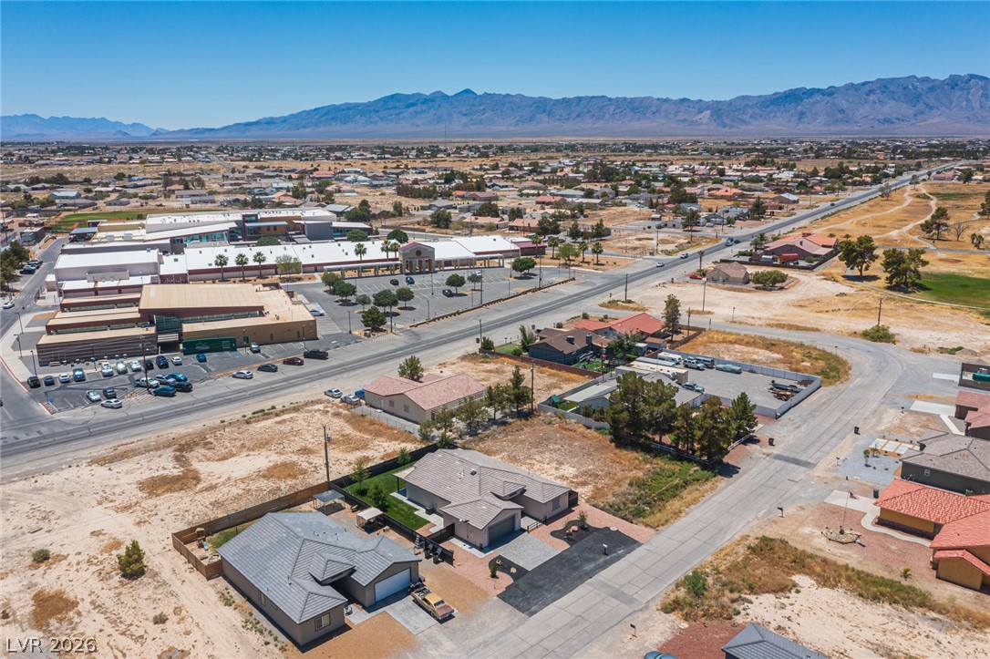 441 Belville Road Pahrump, NV 89048 - Photo 44 of 44 A captivating aerial perspective showcasing a neighborhood nestled against a majestic mountain backdrop.