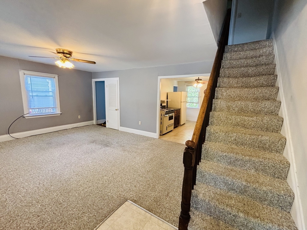 27 Fletcher Street, Unit 1 Northbridge, MA 01588 - Photo 3 of 12 a view of an entryway with staircase