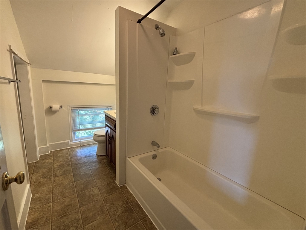 27 Fletcher Street, Unit 1 Northbridge, MA 01588 - Photo 7 of 12 a bathroom with a bathtub and a shower