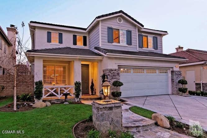 4904 Promenade Street Simi Valley, CA 93063 - Photo 1 of 63 a front view of a house with garden