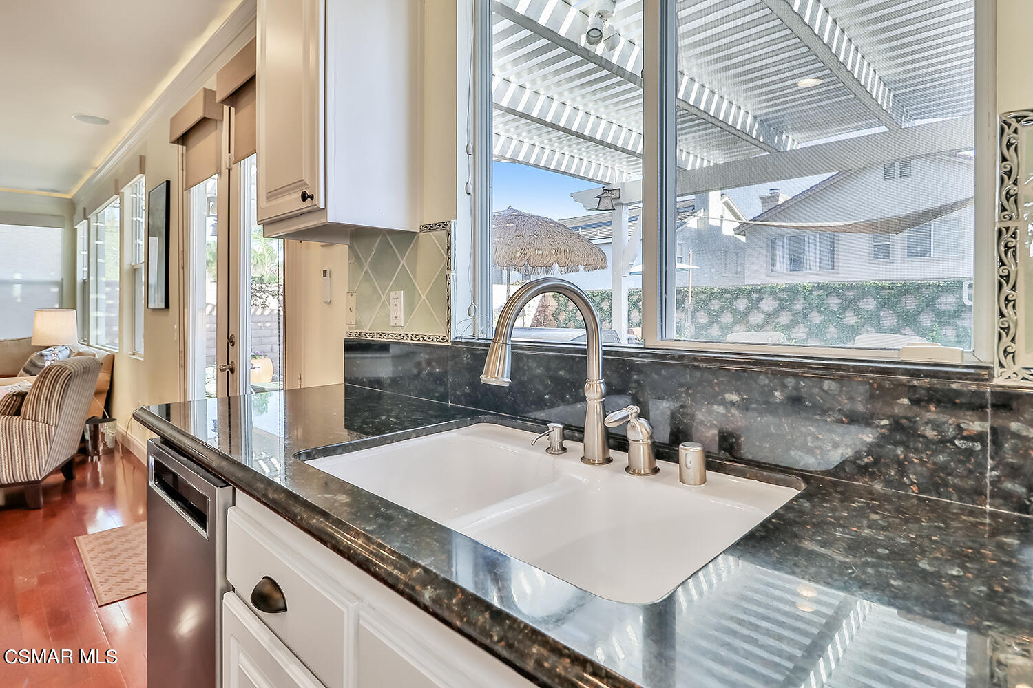 4904 Promenade Street Simi Valley, CA 93063 - Photo 23 of 63 a kitchen with a sink and a window