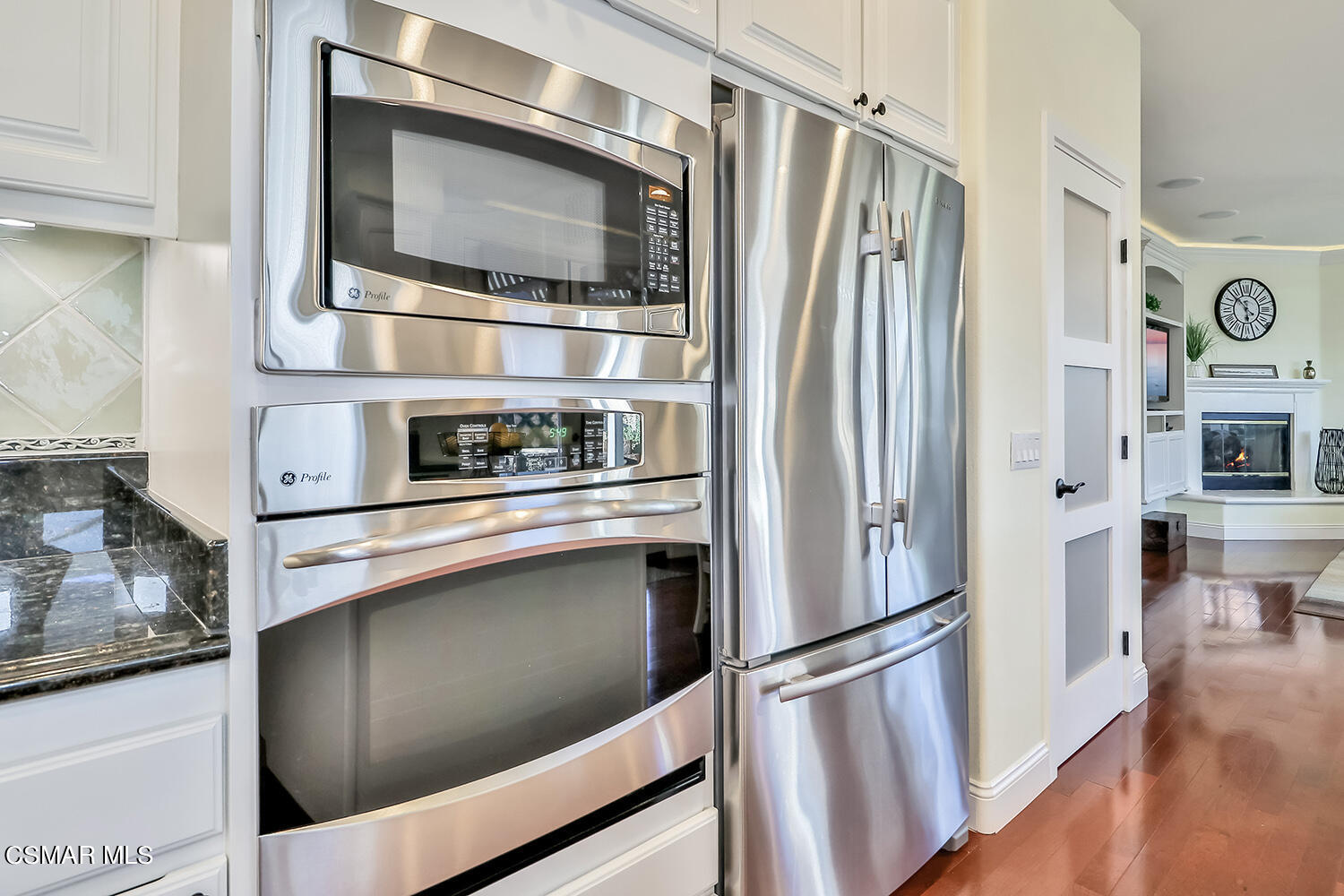 4904 Promenade Street Simi Valley, CA 93063 - Photo 26 of 63 a kitchen with stainless steel appliances and refrigerator