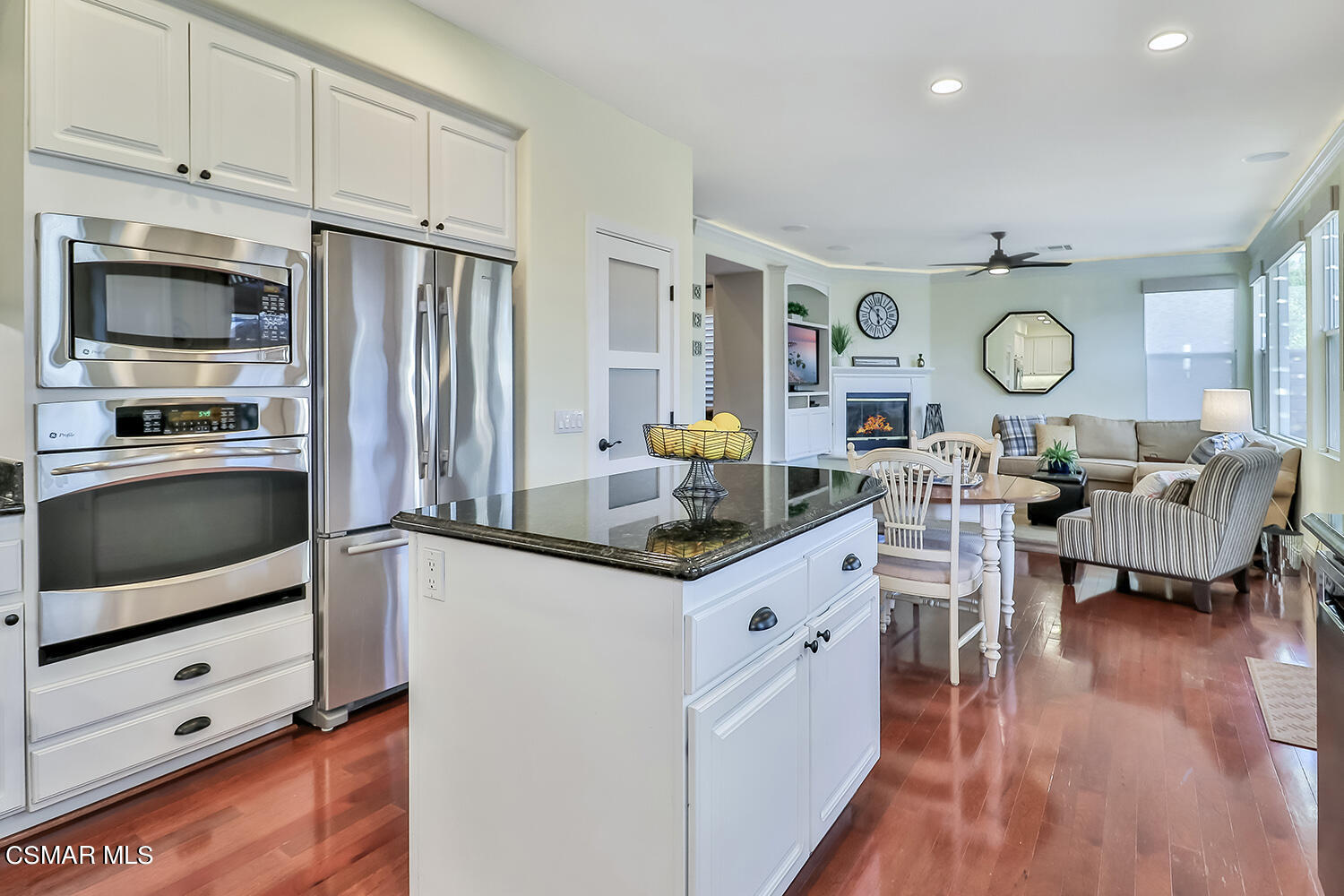 4904 Promenade Street Simi Valley, CA 93063 - Photo 28 of 63 a kitchen with granite countertop a oven a stove a oven a dining table and chairs