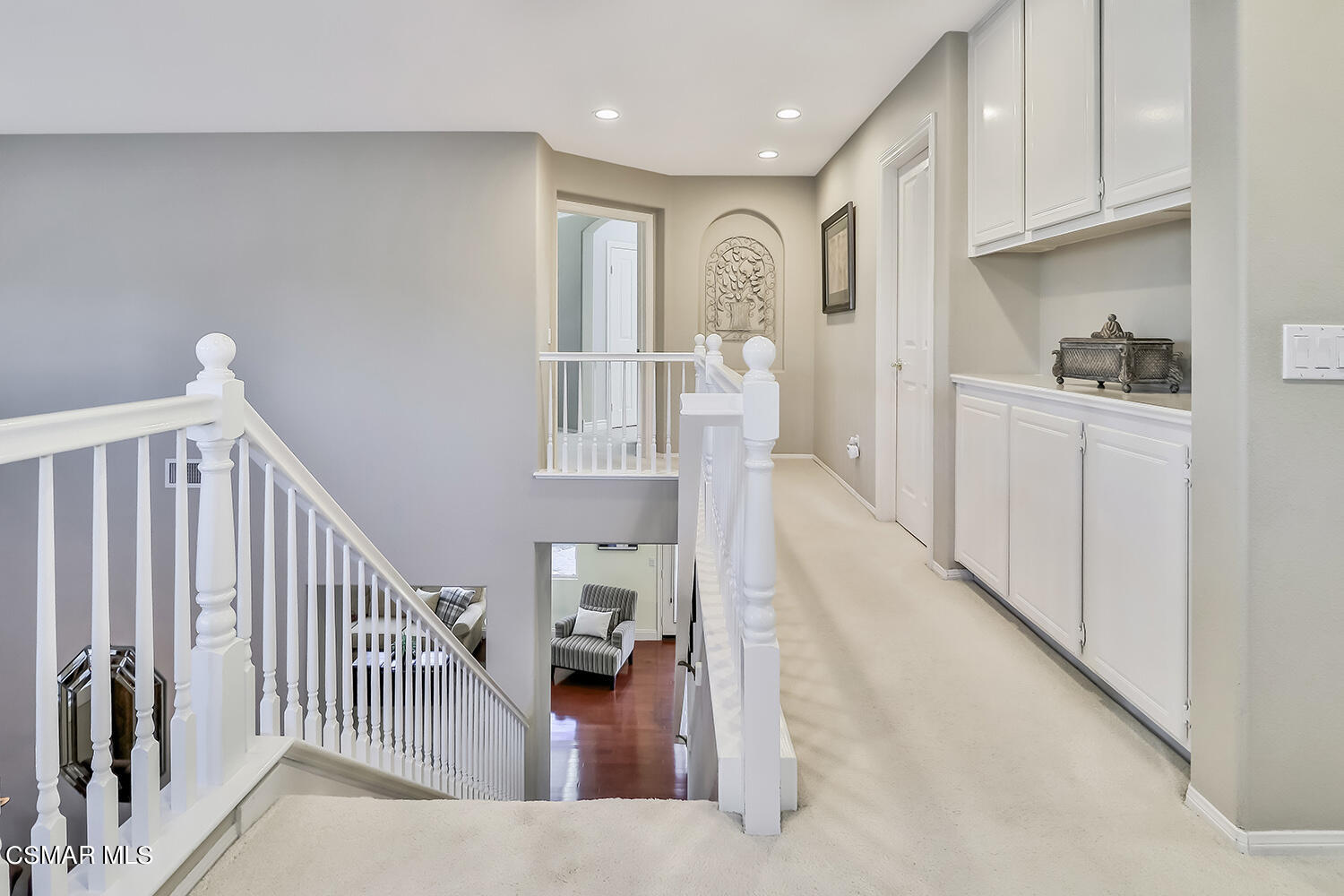 4904 Promenade Street Simi Valley, CA 93063 - Photo 29 of 63 a hallway with white cabinets and wooden floor
