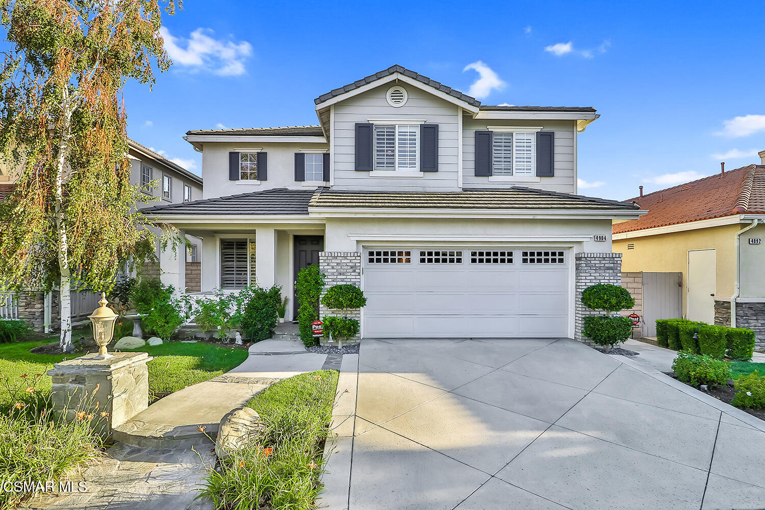 4904 Promenade Street Simi Valley, CA 93063 - Photo 3 of 63 a front view of a house with garden