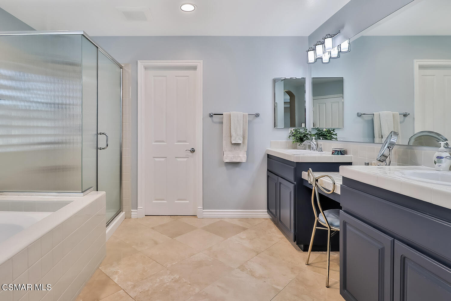 4904 Promenade Street Simi Valley, CA 93063 - Photo 35 of 63 a bathroom with a sink a tub and a mirror