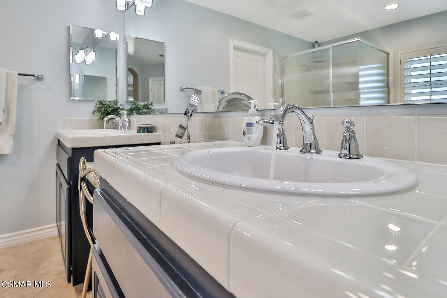 4904 Promenade Street Simi Valley, CA 93063 - Photo 40 of 63 a bathroom with a double vanity sink