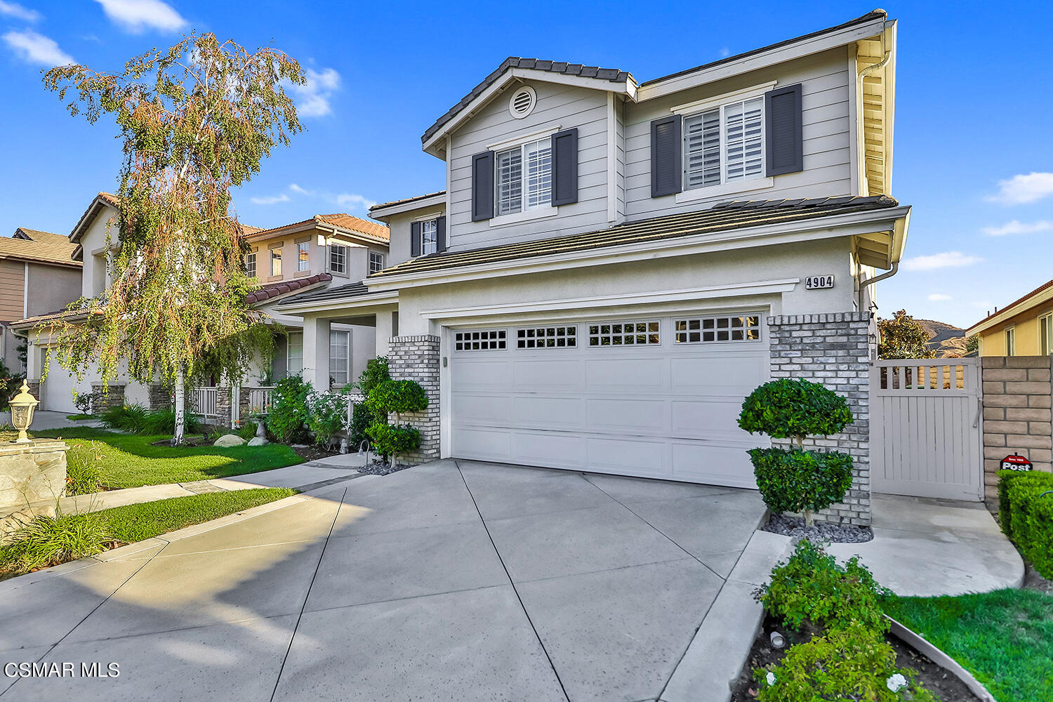 4904 Promenade Street Simi Valley, CA 93063 - Photo 4 of 63 a front view of a house with garden