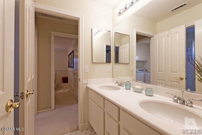 4904 Promenade Street Simi Valley, CA 93063 - Photo 46 of 63 a bathroom with a double vanity sink mirror and double