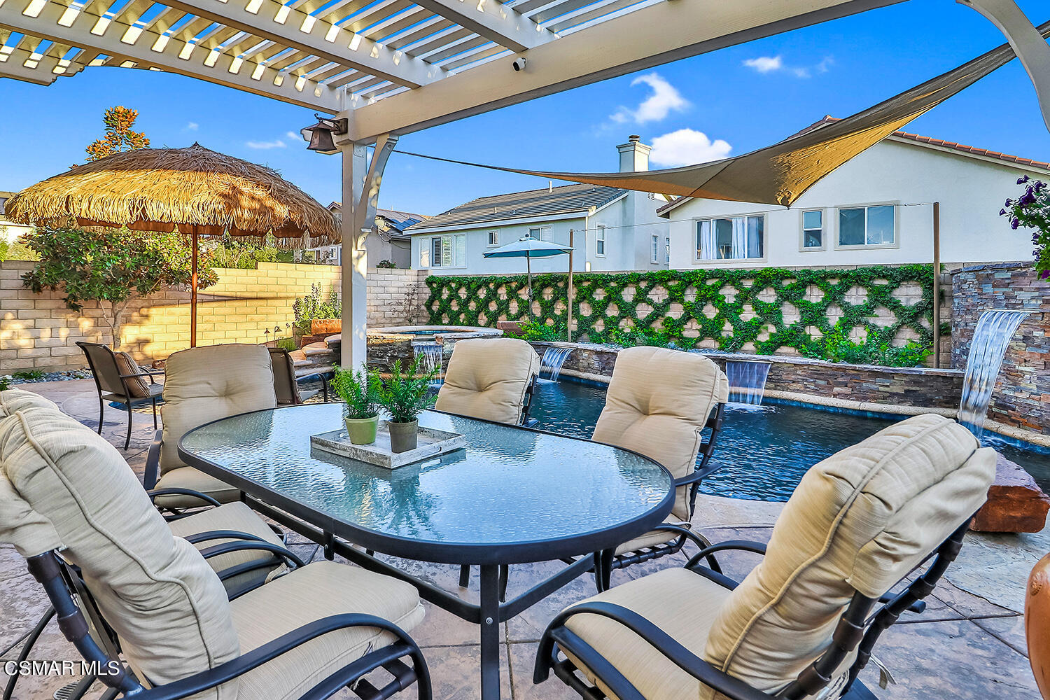 4904 Promenade Street Simi Valley, CA 93063 - Photo 52 of 63 a view of a patio with a dining table and chairs