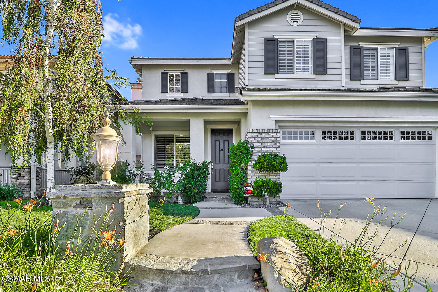 4904 Promenade Street Simi Valley, CA 93063 - Photo 6 of 63 a front view of a house with a yard