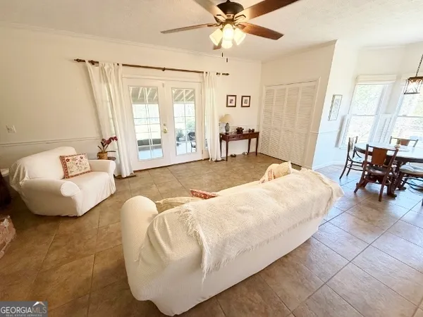 a living room with furniture and a window