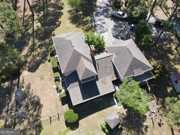 an aerial view of a house with outdoor space