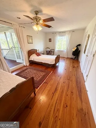 a view of wooden floor in a hall with wooden floor