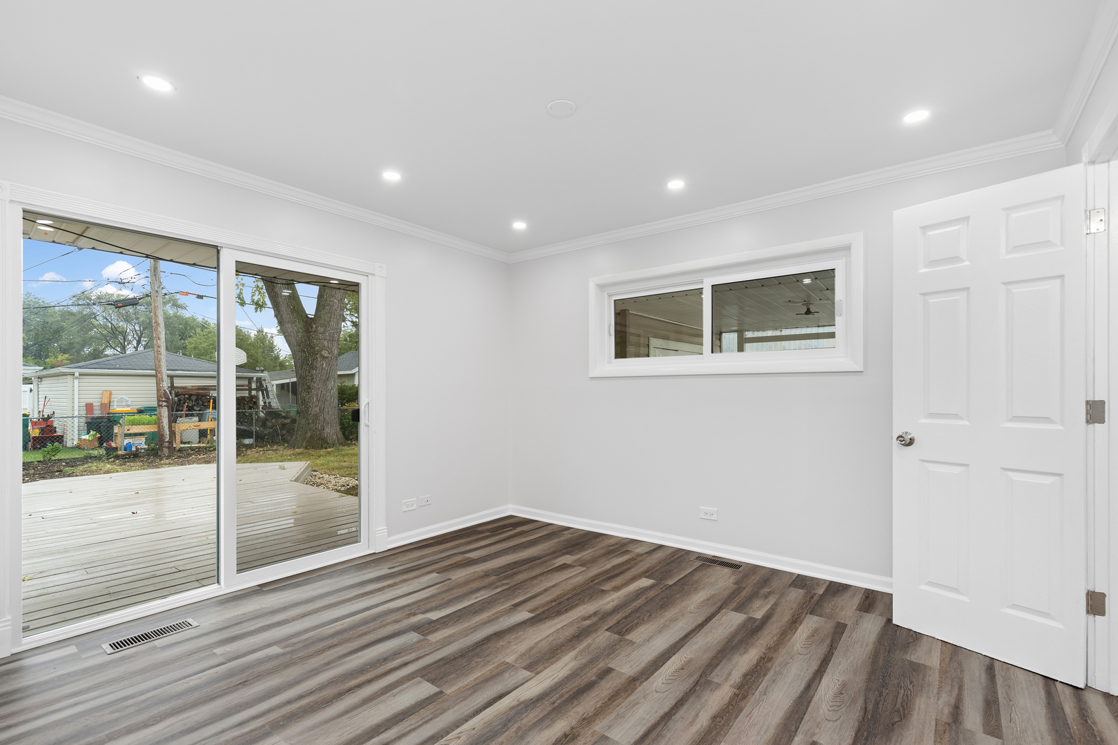 388 Nancy Lane Wheeling, IL 60090 - Photo 13 of 22 a view of empty room with wooden floor and fan