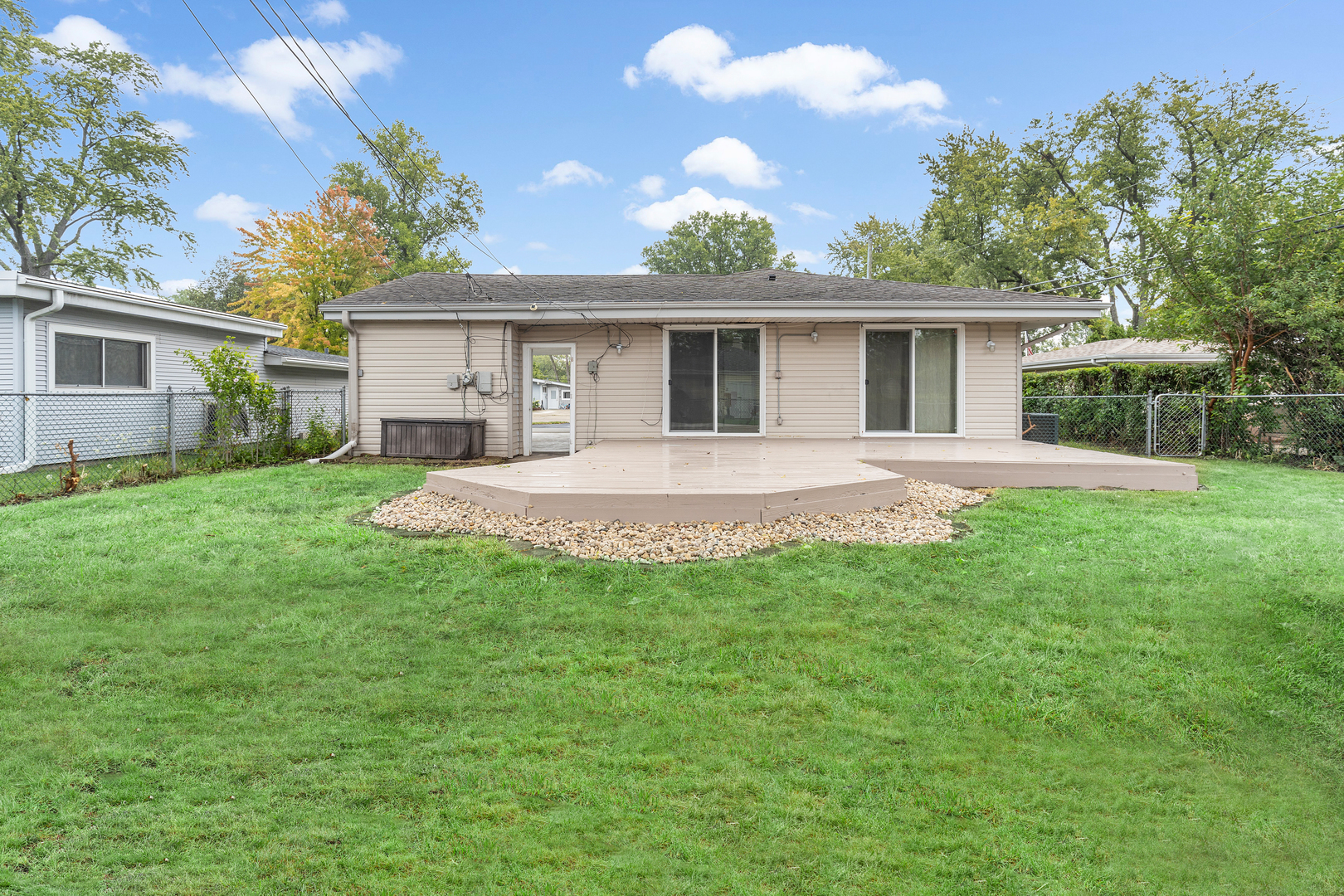 388 Nancy Lane Wheeling, IL 60090 - Photo 20 of 22 a view of a house with a yard and potted plants