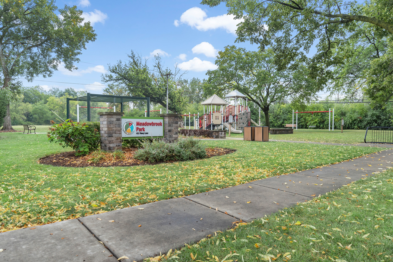 388 Nancy Lane Wheeling, IL 60090 - Photo 22 of 22 a front view of a house with a yard and garage