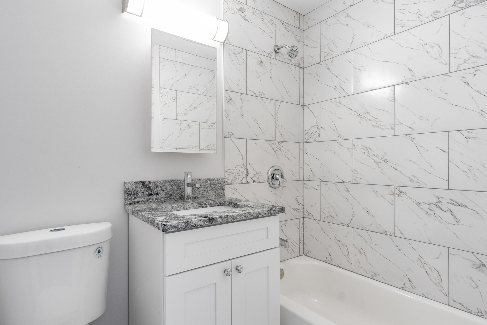 388 Nancy Lane Wheeling, IL 60090 - Photo 10 of 22 a bathroom with a sink toilet and vanity