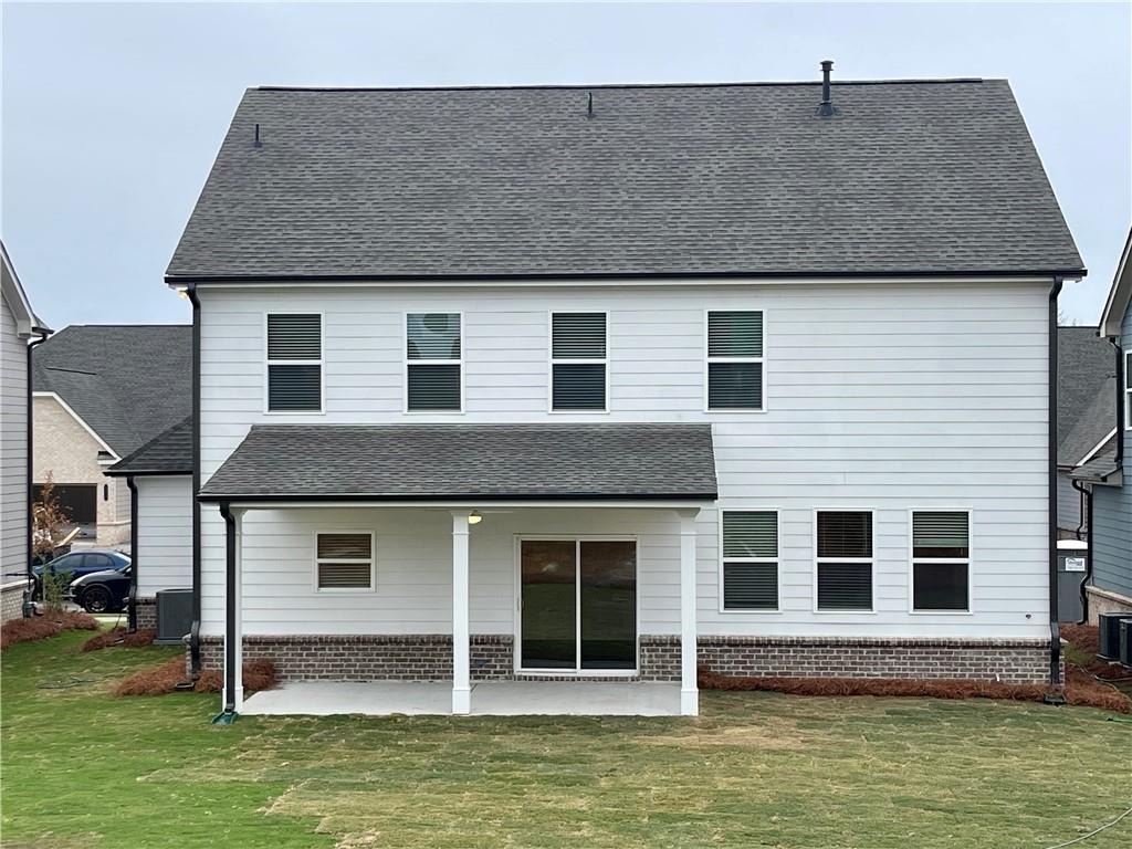 537 Hyde Rdg Trail Loganville, GA 30052 - Photo 22 of 23 a front view of a house with a yard