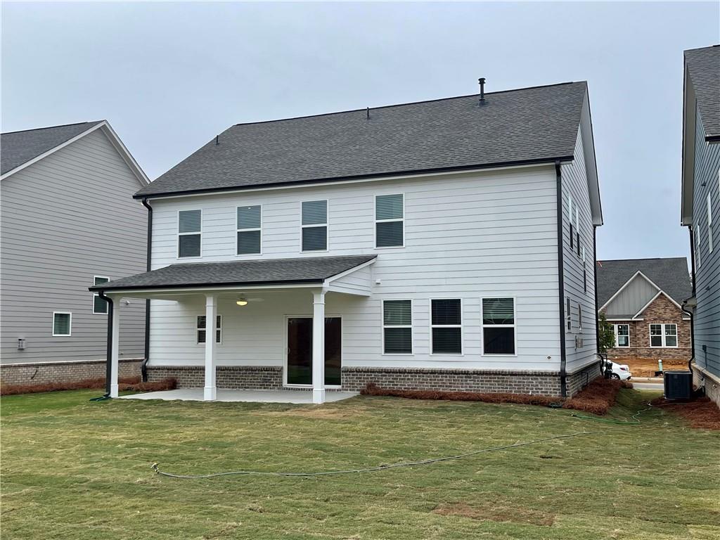 537 Hyde Rdg Trail Loganville, GA 30052 - Photo 23 of 23 a front view of a house with a garden