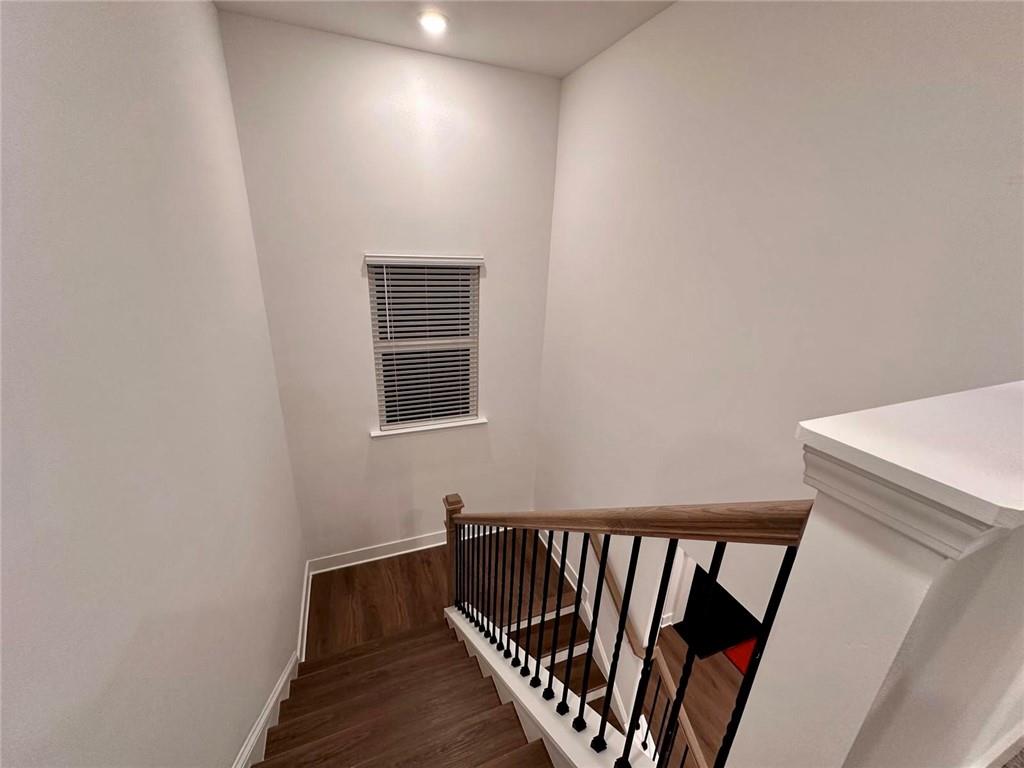 537 Hyde Rdg Trail Loganville, GA 30052 - Photo 7 of 23 a view of hallway with wooden floor