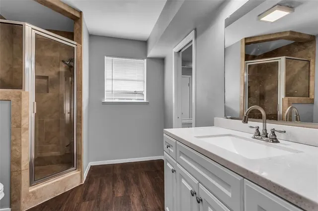 a bathroom with a sink toilet tub and shower